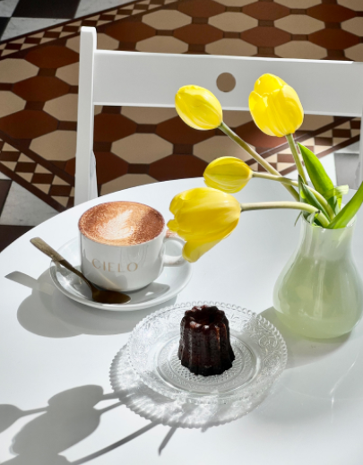 Coffee and flowers sit on table at Cielo in Adelaide