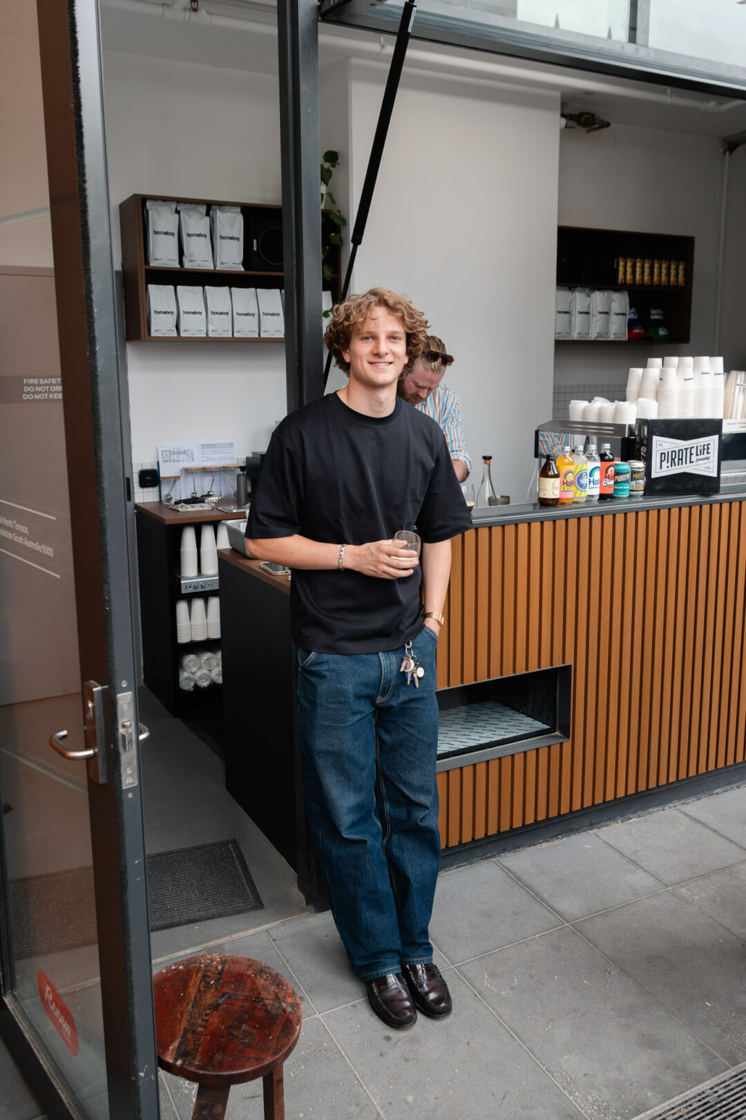 Tom standing outside of his shop