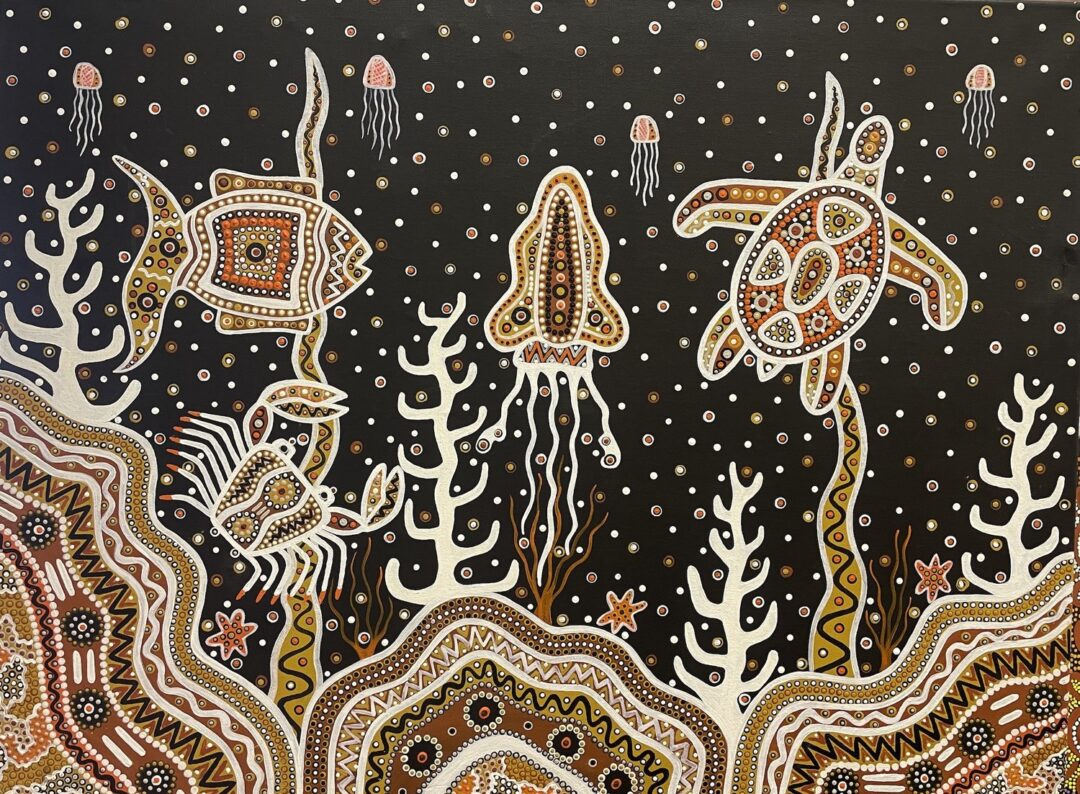 Aboriginal art in earthy, dark colours, showing night sky and a fish and turtle.