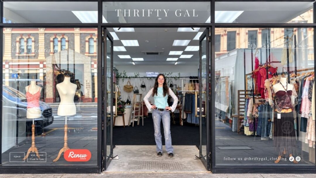 Olivia Davies standing outside retail store, Thrifty Gal.